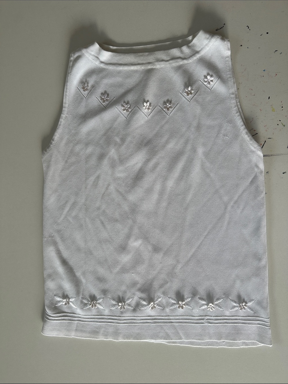 White Sleeveless Knit Top with Embroidered Floral Details